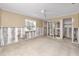 Spacious bedroom with two windows and exposed framing ready to be renovated at 479 80Th Way, St Pete Beach, FL 33706