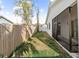 Backyard of home with a wood fence, partial grass coverage, and a screened-in porch at 4907 15Th N Ave, St Petersburg, FL 33710
