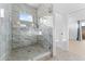 Modern bathroom features a glass enclosed shower with marble surround and hexagon tile floor at 4907 15Th N Ave, St Petersburg, FL 33710