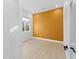Bedroom with a light wood floor, light walls, and an orange accent wall with a window at 4907 15Th N Ave, St Petersburg, FL 33710