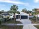 Beautifully landscaped modern home with elegant stone accents and a paved driveway, perfect for curb appeal at 4907 15Th N Ave, St Petersburg, FL 33710