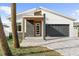 Beautiful home featuring a modern design, stone accents, and a well-manicured lawn, enhancing its curb appeal at 4907 15Th N Ave, St Petersburg, FL 33710