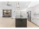 Gourmet kitchen with stainless steel appliances, a large island with a dark countertop, and an open layout at 4907 15Th N Ave, St Petersburg, FL 33710