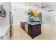Elegant kitchen with stainless steel appliances, an island with stone countertops, and mural accent wall at 4907 15Th N Ave, St Petersburg, FL 33710