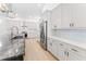 Modern kitchen with white cabinets, stainless steel appliances, and a spacious center island at 4907 15Th N Ave, St Petersburg, FL 33710