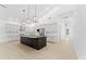 This kitchen boasts ample space, an island with sink, and stainless steel appliances at 4907 15Th N Ave, St Petersburg, FL 33710