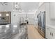 Modern kitchen featuring white cabinets, stone countertops, an oversized island and stainless steel appliances at 4907 15Th N Ave, St Petersburg, FL 33710