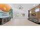 A bright open concept living space with a tropical mural and modern fireplace at 4907 15Th N Ave, St Petersburg, FL 33710