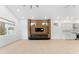 Living room with a modern fireplace, wood accent wall, and minimalist design at 4907 15Th N Ave, St Petersburg, FL 33710