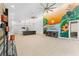 Spacious living room with high ceilings, modern mural, and open floor plan at 4907 15Th N Ave, St Petersburg, FL 33710