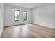 Bright, expansive bedroom with hardwood floors, and many windows offering abundant natural light at 5017 W Dickens Ave, Tampa, FL 33629