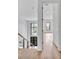 Bright entryway with hardwood floors, black framed windows and modern staircase with metal railings at 5017 W Dickens Ave, Tampa, FL 33629