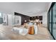 Open-concept living area showcasing a modern wine cellar, comfortable seating, and seamless transition to the kitchen at 5017 W Dickens Ave, Tampa, FL 33629