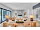 Bright and spacious living room featuring a modern fireplace, stylish decor, large sliding glass doors, and natural light at 5017 W Dickens Ave, Tampa, FL 33629