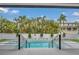 Backyard swimming pool surrounded by lush tropical landscaping, offering a private oasis at 5017 W Dickens Ave, Tampa, FL 33629