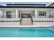 Resort-style swimming pool with elevated spa and modern architecture at 5017 W Dickens Ave, Tampa, FL 33629