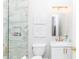 Stylish bathroom featuring marble tile, gold fixtures, framed art and a glass-enclosed shower at 5546 Drexel Rd, Land O Lakes, FL 34638