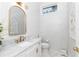 Elegant bathroom with marble vanity, gold fixtures, and stylish accents at 5546 Drexel Rd, Land O Lakes, FL 34638