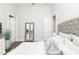 This bedroom has hardwood floors, a large framed mirror, and a flat screen television at 5546 Drexel Rd, Land O Lakes, FL 34638