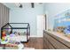Charming bedroom with wood floors featuring neutral colored walls and modern furnishings at 5546 Drexel Rd, Land O Lakes, FL 34638