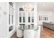 Bright dining area featuring modern chandelier and a glass-topped table with cushioned chairs at 5546 Drexel Rd, Land O Lakes, FL 34638