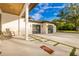 Stunning modern home boasts a three-car garage, spacious driveway, and inviting front porch with rocking chairs at 5546 Drexel Rd, Land O Lakes, FL 34638