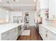 Bright kitchen featuring marble countertops, stainless steel appliances, and hardwood flooring at 5546 Drexel Rd, Land O Lakes, FL 34638