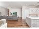 Bright living room connected to kitchen and dining area, showcasing an open layout at 5546 Drexel Rd, Land O Lakes, FL 34638