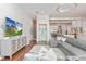Spacious living room with large tv, modern decor, and a view of the kitchen and wine room at 5546 Drexel Rd, Land O Lakes, FL 34638