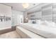 Spacious main bedroom showcases elegant decor, a padded headboard, and a cozy seating area at 5546 Drexel Rd, Land O Lakes, FL 34638