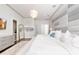 Bright main bedroom boasting chic decor, an ensuite bathroom, and plenty of natural light at 5546 Drexel Rd, Land O Lakes, FL 34638