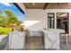 Well-equipped outdoor kitchen features marble counters, stainless steel grill, and bar seating at 5546 Drexel Rd, Land O Lakes, FL 34638