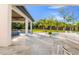 Expansive outdoor living area with a patio, fireplace, and in-ground pool at 5546 Drexel Rd, Land O Lakes, FL 34638