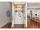 Custom wine room with glass doors and space for ample wine bottle storage at 5546 Drexel Rd, Land O Lakes, FL 34638