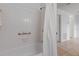 Bright bathroom featuring a bathtub with a shower at 5969 Terrace Park N Dr # 203, St Petersburg, FL 33709