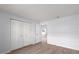 Neutral bedroom with wood floor and large closet at 5969 Terrace Park N Dr # 203, St Petersburg, FL 33709