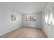Bedroom with wood-look floors, closet and natural light at 5969 Terrace Park N Dr # 203, St Petersburg, FL 33709