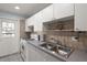 Updated kitchen includes white appliances and neutral countertops at 5969 Terrace Park N Dr # 203, St Petersburg, FL 33709