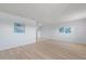 Bright and airy living room with wood floors, neutral walls, and soft, natural light at 5969 Terrace Park N Dr # 203, St Petersburg, FL 33709