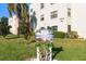 Close up of the Concord community sign with mature trees and a manicured lawn at 5969 Terrace Park N Dr # 203, St Petersburg, FL 33709