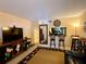Cozy living room with tile floors, chic rug, bar-style dining, mirror feature, and modern decor at 7138 E Bank Dr # 7138, Tampa, FL 33617