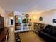 Charming living room featuring tile floors, modern decor and cozy seating arrangement at 7138 E Bank Dr # 7138, Tampa, FL 33617