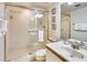 Bathroom featuring a glass-enclosed shower, toilet, and vanity with sink at 7564 Bayshore Dr # 207, Treasure Island, FL 33706