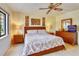 Comfortable bedroom with king size bed, and a dresser set with mirror at 7564 Bayshore Dr # 207, Treasure Island, FL 33706
