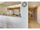 Well-lit kitchen area featuring a breakfast bar, modern appliances, and convenient access to other rooms at 7564 Bayshore Dr # 207, Treasure Island, FL 33706