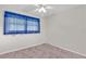 Bright bedroom with plush carpet, neutral walls and a ceiling fan at 8490 7Th N Ln, St Petersburg, FL 33702