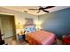 Relaxing bedroom featuring a woven chair, tropical art, and a bright bedspread at 1020 Bowsprit Ln # X, Holiday, FL 34691