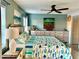 Bright bedroom with a ceiling fan, tropical décor, and matching nightstands and dressers at 1020 Bowsprit Ln # X, Holiday, FL 34691