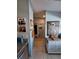 Hallway with coastal-inspired decor, granite counters, and art that adds a personal touch to the home at 1020 Bowsprit Ln # X, Holiday, FL 34691