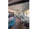 Bright sunroom with comfortable seating, natural light, and views of the lush greenery at 1020 Bowsprit Ln # X, Holiday, FL 34691